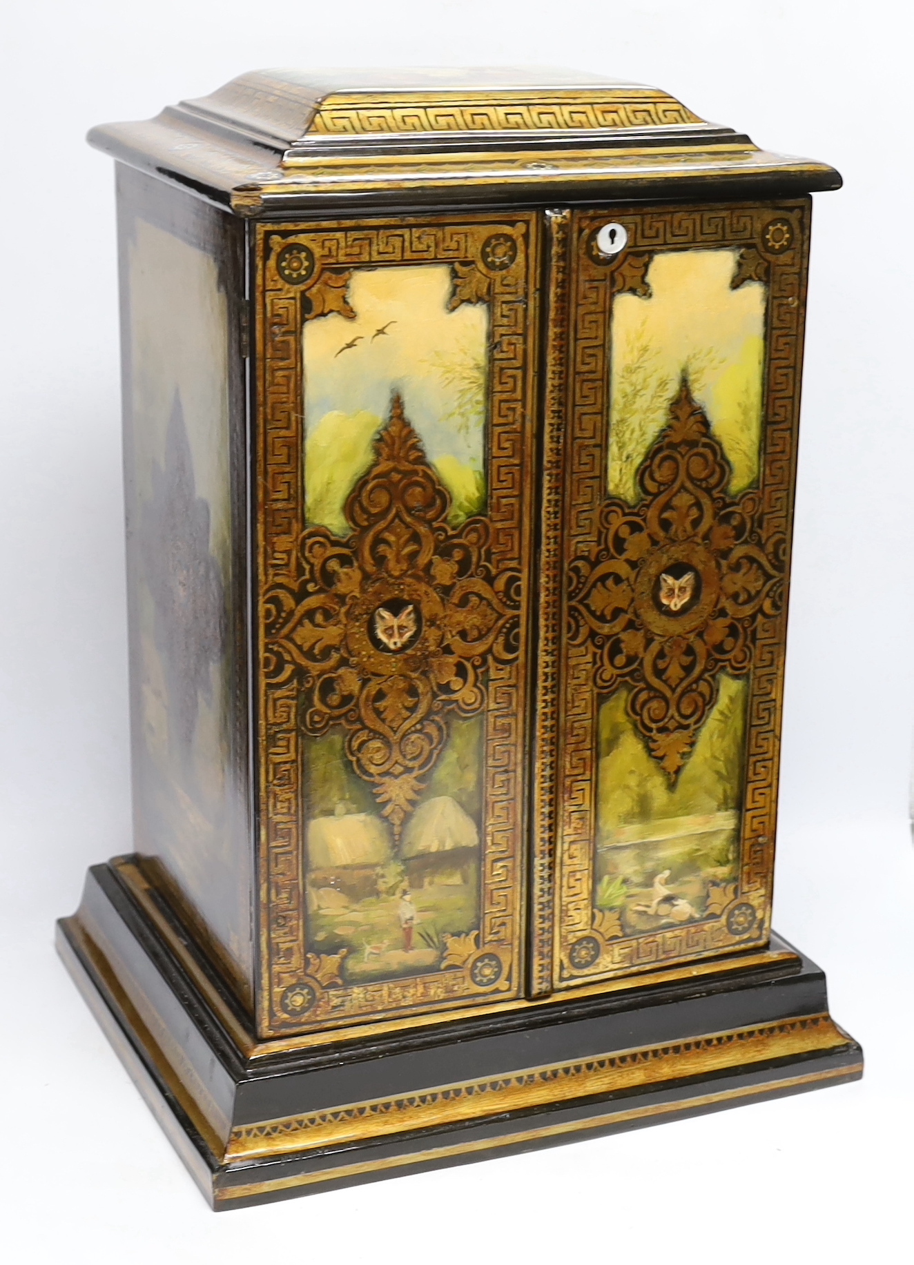 A Victorian painted papier maché decanter box, 51cm high x 36cm wide